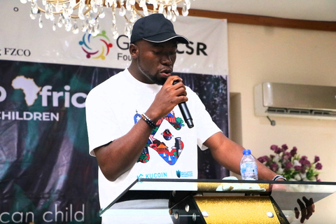 KuCoin representative Olatunde delivering a speech on KuCoin's charitable initiative. (Photo: Business Wire)