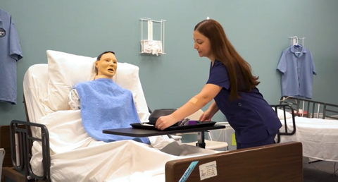 thumbnail A Learn4Life student trains with a mannequin during clinical instruction to become a Certified Nursing Assistant (Photo: Business Wire)