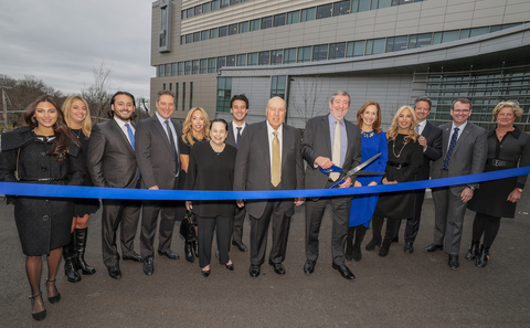 Northwell Health CEO Michael Dowling (with scissors) and Trustee Chair Margaret Crotty (right) surrounded by Northwell leaders and members of the Petrocelli family at the dedication of the $560 million Petrocelli Surgical Pavilion at North Shore University Hospital in Manhasset, NY. (Credit: Northwell Health)