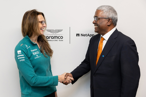 Clare Lansley (left), CIO of Aston Martin Aramco and George Kurian (right), CEO of NetApp, shake hands to celebrate their companies’ partnership renewal. (Photo: Business Wire)