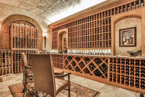 The climate-controlled wine cellar can store +2,200 bottles, with plenty of room for tastings. OceanfrontLuxuryAuction.com. (Photo: Business Wire)