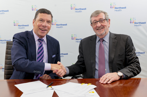 From left: John M. Murphy, MD, president and CEO of Nuvance Health, shakes hands with Northwell President and CEO Michael Dowling, at a signing ceremony. Credit Northwell Health