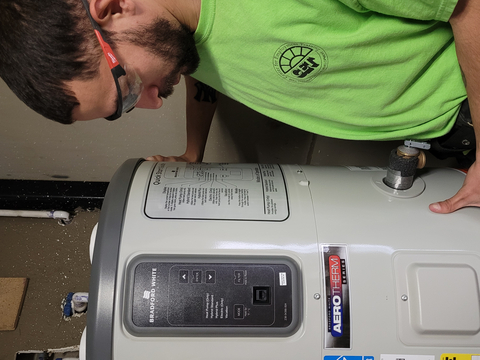A Center for Employment Training student inspects the new energy efficient heat pump water heater donated by Bradford White Corporation through its signature charitable giving initiative, Industry Forward®. (Photo: Business Wire)