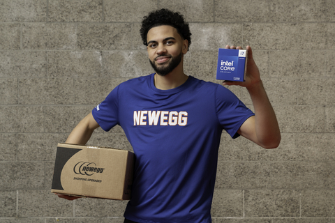Ajay Mitchell, point guard for the UC Santa Barbara men's basketball team, shows off an Intel® Core™ 14th Gen processor box from Newegg. (Photo: Newegg)