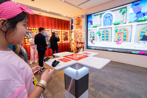 In this photo provided by Nintendo of America, the newly released pastel pink Joy-Con controllers debut alongside Princess Peach: Showtime! at the launch celebration at the Nintendo New York store in Rockefeller Center.