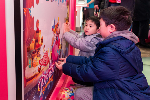 In this photo provided by Nintendo of America, fans gather at the Nintendo New York store in Rockefeller Center to celebrate the game launch of Princess Peach: Showtime! with theatrical décor, gameplay and activities!