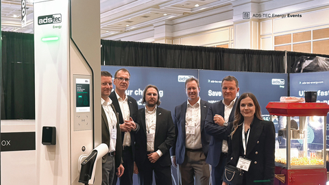 ADS-TEC Energy's Founder and CEO Thomas Speidel (second from right) with his team at EV Charging Summit & Expo (Photo: Business Wire)