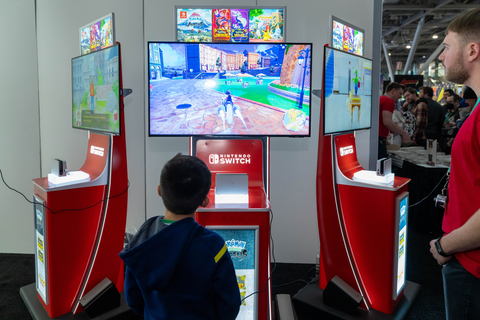 In this photo provided by Nintendo of America, Marcelo, 7, enjoys a demo of the Pokémon Violet game at PAX East