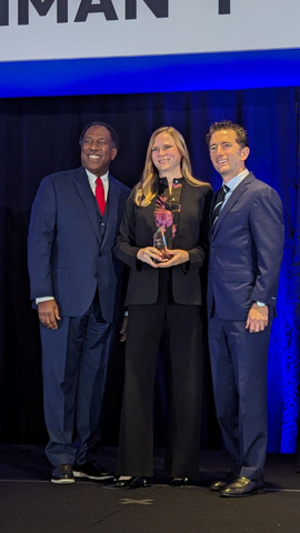 original Mardi Norman, CEO of Dynamic Systems, Inc., accepting Quality award from Northrop Grumman in Tysons Corner, VA, at the 2024 Supplier Excellence Awards Summit. Pictured from left to right: Ken Brown, VP Enterprise Global Supply Chain, NGC; Mardi Norman, President and CEO, Dynamic Systems, Inc.; Matt Bromberg, Corporate VP, Global Operations, NGC (Photo: Business Wire)
