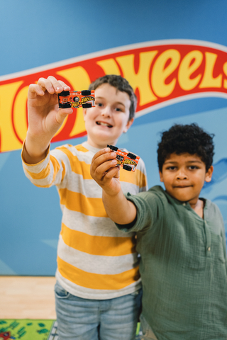 Children playing with Mattel's Hot Wheels® Flippin Fast™ die-cast, a new vehicle designed to encourage an open-ended play experience, developed in partnership with the Autistic Self Advocacy Network (ASAN). (Photo: Business Wire)
