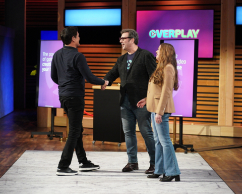Mark Cuban and Overplay co-founders Dan Projansky and Caroline Strzalka shaking hands on the set of Shark Tank after striking a deal. Photo Credit: ABC