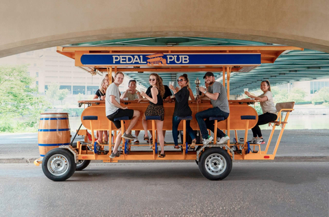 Pedal Pub offers community members and tourists alike a chance to socialize with friends, partake in a light workout and tour neighborhoods and cities in an exciting, unique way. Source: pedalpub.com (Photo: Business Wire)