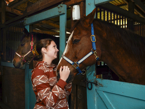 original Amelia shown here with her equine friend, Rip, who helps others with mental health and wellness therapy. (Credit: Inspira Health)
