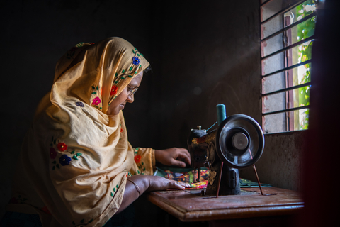 Fatema Akter is a schoolteacher who does tailoring at home in the evenings. Her glasses have made it possible for her to easily read her school materials and to accomplish detailed stitching. (Photo: Business Wire)