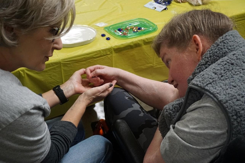 original Pam Self, resident manager for Corvias Property Management at Fort Johnson, volunteers at Louisiana Lions Camp. (Photo: Business Wire)