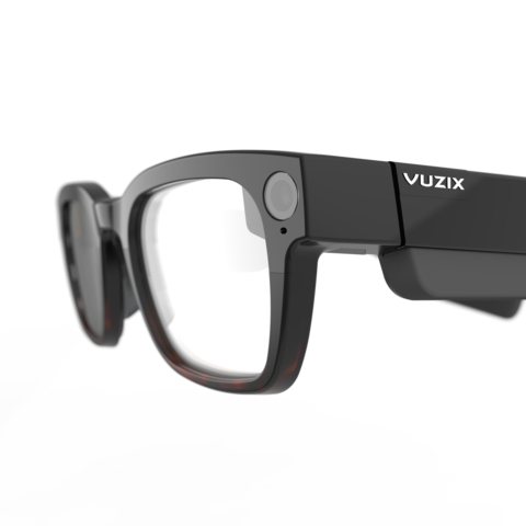 Vuzix Shield™ AR glasses, the world's first binocular waveguide smart glasses implemented for industrial use, utilizes poLight ASA TLens® in its two front-facing stereo RGB autofocus cameras. With poLight tunable optics, the award-winning glasses offer robust, constant field-of-view autofocus functionality and are now available to the general public via www.Vuzix.com. (Photo: Business Wire)