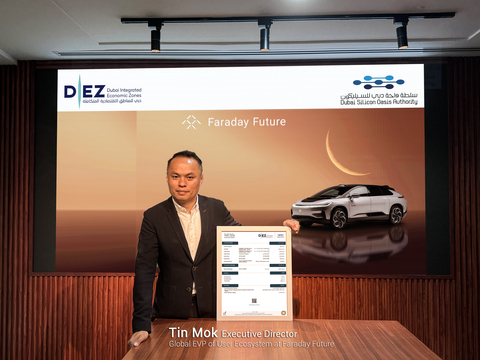 Tin Mok, Executive Director and Global Executive Vice President of User Ecosystem at Faraday Future, presents the trade license of FF's Middle East sales entity. (Photo: Business Wire)
