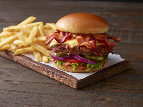 Applebee's launches the NEW Whole Lotta Bacon Burger featuring Applewood-smoked bacon seared into an all-beef patty, topped with three slices of bacon, and tangy bacon sauce. (Photo: Business Wire)