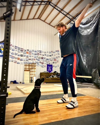 Gold Medal winner Ryan Crouser attributes a part of his success and dominance in world shot put competition to his loyal training partner, Koda. He attributes Koda’s health and wellbeing to the nutrition he receives from eating Nulo. See his story at: https://nulo.com/ambassador-stories/ryan-crouser-and-koda (Photo: Business Wire)