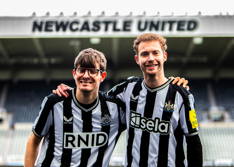 Newcastle United fans David Wilson and Ryan Gregson unveil Sela’s haptic shirts that will for the first time enable deaf fans to feel the atmosphere of the crowd inside St. James’ Park for Premier League game with Tottenham Hotspur on Saturday April 13. Sela will also donate its front-of-shirt logo placement and pitch side advertising rights to major deaf and hearing loss charity RNID for the game. Photo credit: Lucy Ray/PA Media