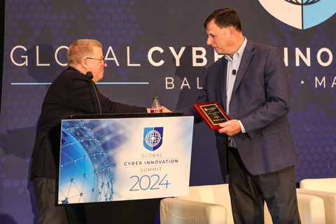 Bob Ackerman presenting the Cyber Vanguard Award to Rob Joyce in a special achievement presentation at GCIS 2024 (Photo: Business Wire)