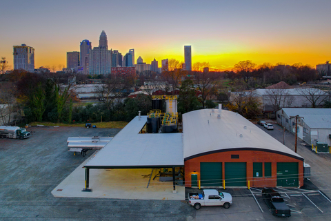 Aerial image of the Charlotte Greasecycle facility at sunset with uptown in view. (Photo: Business Wire)