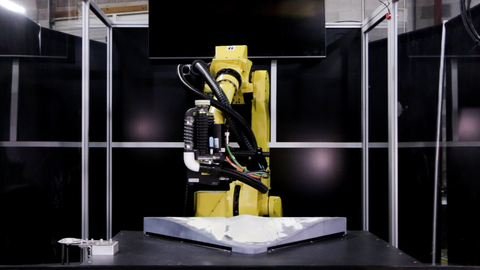 A robot scans a component using MAS's QC Plus™ software which will create and adapt custom paths to sand, a new process in robotics called intelligent adaptive sanding. (Photo: Business Wire)