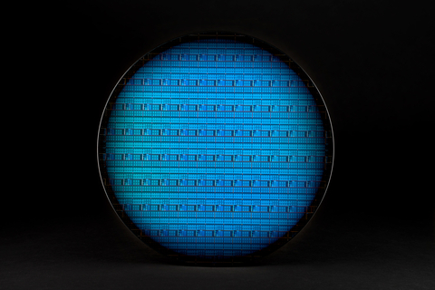 A photo shows a 300-millimeter Intel silicon spin qubit wafer. In May 2024, Nature published an Intel research paper, “Probing single electrons across 300-mm spin qubit wafers,” demonstrating state-of-the-art uniformity, fidelity and measurement statistics of spin qubits. (Credit: Intel Corporation)