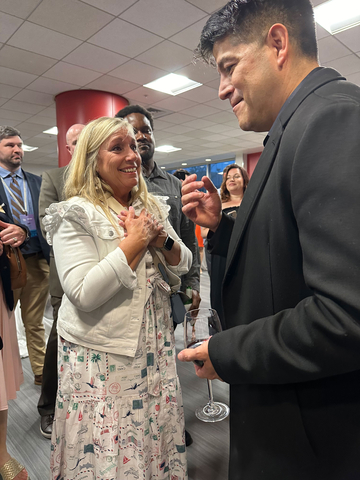 Ouro CEO Roy Sosa and a 2024 honoree visit at the 2024 National Teachers of the Year event April 30 where Sosa presented Ouro's  $275,000 gift. Each of the 55 teachers to earn the recognition this year will receive $5,000. (Photo: Business Wire)
