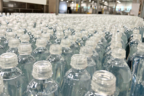 Origin CSD 1881 PET caps running on a commercial bottling line (Photo: Business Wire)