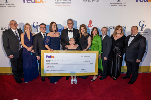 St. Jude patient Misheel poses with Esperanza Lopez-Virtue and the FedEx Team, title sponsors of the gala. (Photo: Carlos Aristizabal)