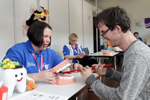 A Special Olympics athlete receives oral health education during a free screening at Special Olympics Healthy Athletes® at the 2017 Special Olympics World Winter Games in Austria. (Photo: Business Wire)