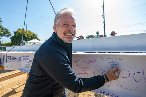 thumbnail President of Skechers and the Skechers Foundation, and Friendship Foundation co-founder Michael Greenberg signs the final beam to complete structural framing of the Friendship Campus created for neurodiverse students in Redondo Beach, Calif. May 8, 2024 (Photo: Business Wire)