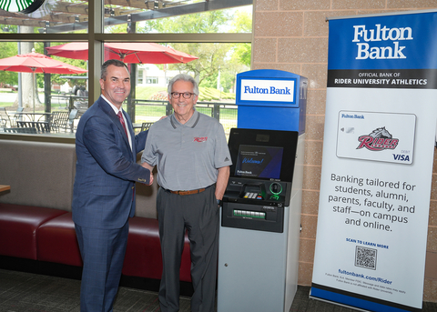 Curt Myers, Chief Executive Officer of Fulton Bank (at left), stands with Rider University President Gregory Dell'Omo at the new Fulton Bank ATM in the university's student recreation center. (Photo: Business Wire)