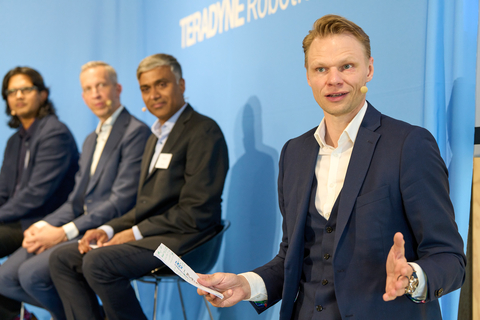 Kim Povlsen, President of Universal Robots, welcomes guests at the opening of the new joint headquarters with Mobile Industrial Robots. Panelists (from left) Deepu Talla, Head of Robotics at Nvidia; Rainer Brehm, CEO of Siemens Factory Automation; and Ujjwal Kumar, President of Teradyne Robotics, also participated in the Grand Opening, discussing the use of physical AI across industries. (Photo: Business Wire)