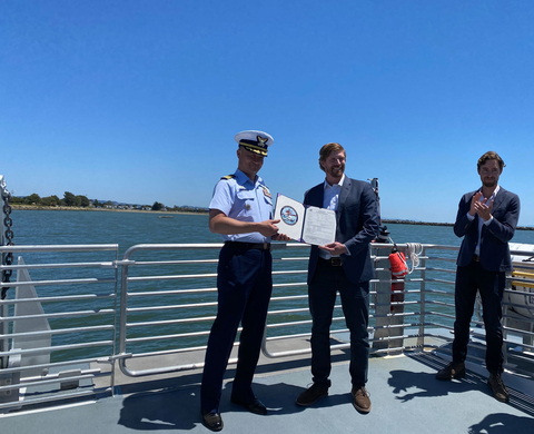 Captain Taylor Q. Lam presents Pace Ralli, CEO of SWITCH Maritime, with signed Certificate of Inspection (Photo: Business Wire)