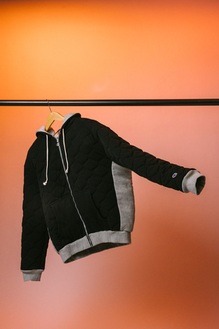 Weighing 8lbs, this machine-washable hoodie is quilted with micro glass beads and was designed to leverage the scientifically proven benefits of weighted pressure seen in weighted blankets, which may reduce symptoms of stress and anxiety among a host of other mental health and neurodivergent conditions. The hoodie was developed in collaboration with Thera - a small business founded by Jenny Rosenberg, who began manufacturing weighted wearable products during the pandemic. (Photo: Business Wire)
