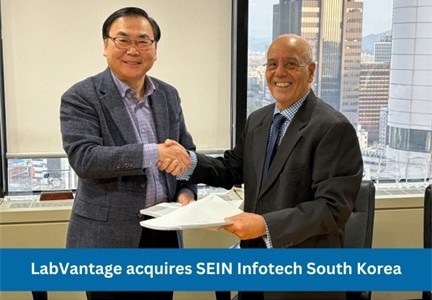Michel Gerlicher, President of LabVantage International (R), and Jung Moon Lee, CEO of SEIN Infotech (L), seal the acquisition with a handshake. (Photo: Business Wire)
