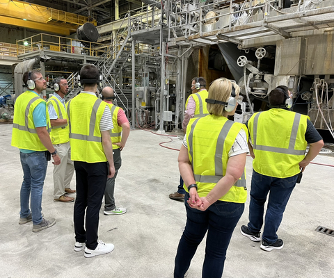 Touring the paper making process. (Photo: Business Wire)