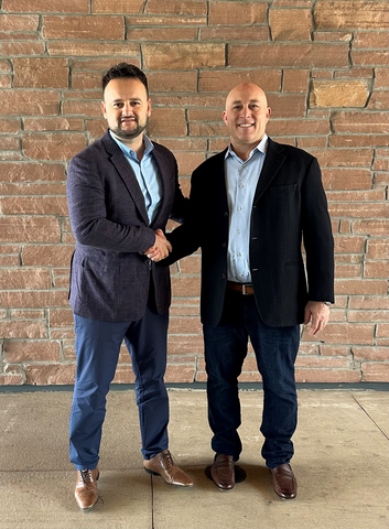 Lou Sylaj from ATS and Mike Maiorino from HRMS seal the deal (Photo: Business Wire)