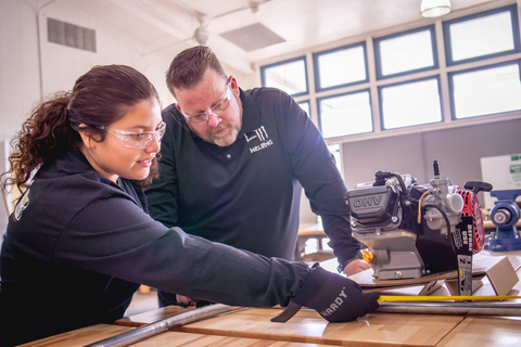 High school student Nataliah Castro measures an engine while her instructor Brent Tuttle supervises as part of the LA County Skilled Trades Summers program (Photo by Ben Gibbs/Harbor Freight Tools for Schools) (Photo: Business Wire)