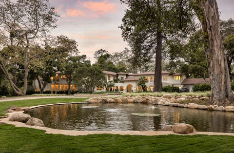 Experience serenity at Monte Arroyo Estate, where the stately c.1910 residence is mirrored in a tranquil lily pond and embraced by nearly four acres of botanical wonderland. Photo: Elevated Horizon, Eric Foote.