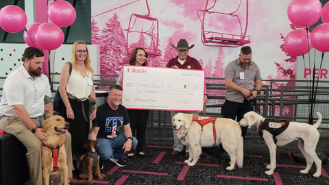 Hero's Puppy for Life founder and ADA compliant service dogs visit the Colorado Springs T-Mobile Customer Experience Center to accept their $10,000 donation. (Photo: Business Wire)