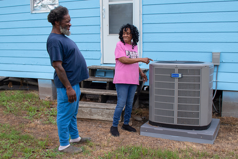 A Mississippi homeowner proudly points to the new air conditioner she was able to install thanks to an $8,000 Special Needs Assistance Program grant from Federal Home Loan Bank of Dallas. (Photo: Business Wire)