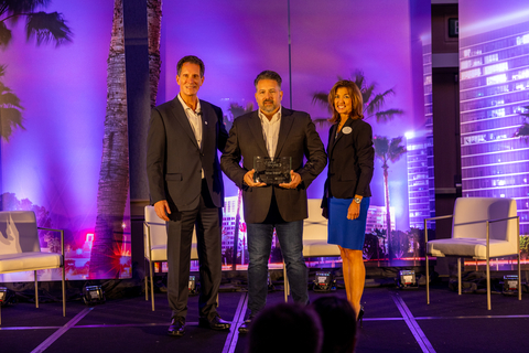Terran Orbital COO Peter Krauss accepting award on behalf of Terran Orbital. Presented by Dave Coffaro (L), Interim President and CEO of the Greater Irvine Chamber and Lisa Thomas (R), Chair of the Board for the Greater Irvine Chamber. (Photo Credit: Terran Orbital)