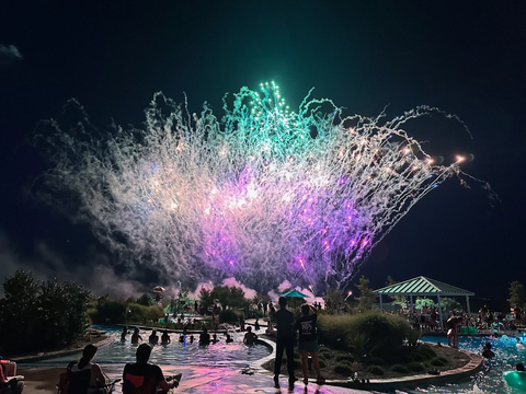 Inspiration residents enjoy fireworks from the community lazy river (Photo: Business Wire)