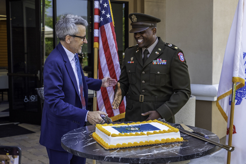 David Spector, Chairman and CEO, Pennymac cutting the cake with MAJ Tyran Askew, Executive Officer, L.A. Recruiting Battalion (Photo: Business Wire)