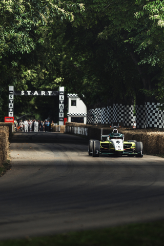 The world's fastest autonomous racecar with an AI pilot coded by students from PoliMOVE-MSU team races on Goodwood Hill. Credit Indy Autonomous Challenge. (Photo: Business Wire)