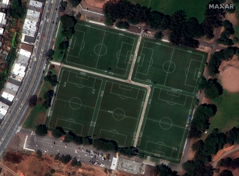 This WorldView Legion image shows people playing on soccer fields, with cleanly defined white boundary lines and stadium lights. (Photo: Maxar Intelligence)