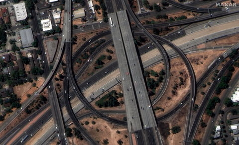 This WorldView Legion image shows the interchange between Highway 50 and Elvas Freeway, southeast of downtown Sacramento, with vehicles in motion and roadway markings clearly visible. (Photo: Maxar Intelligence)